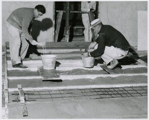 Nivola and assistant pouring a custom mixture.